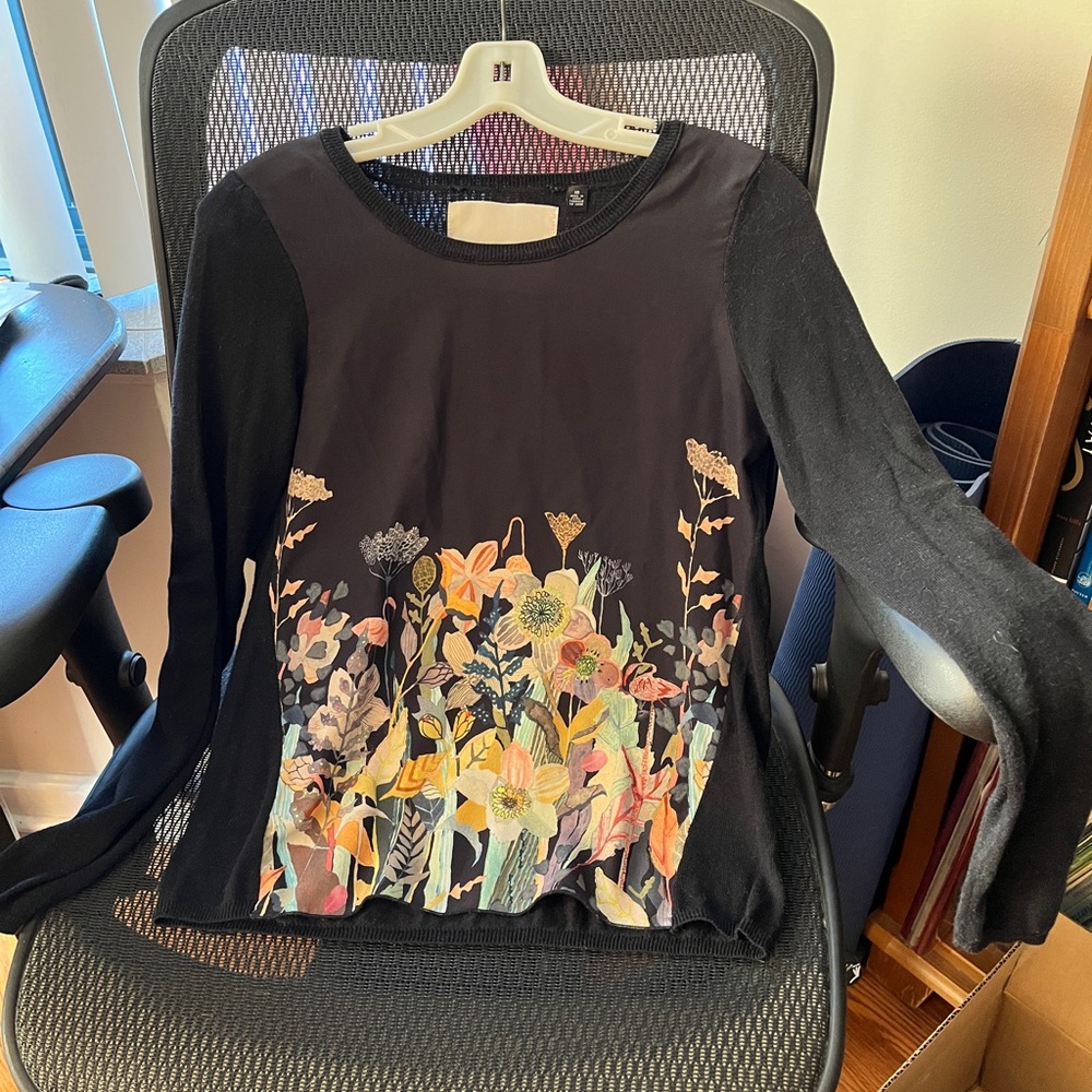 Anthropology Long Sleeve Top. Lovely flower garden scene on front, black back